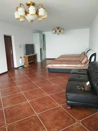 Imagen de la habitación del Hotel Weihai Haina Holiday Apartment. Foto 16