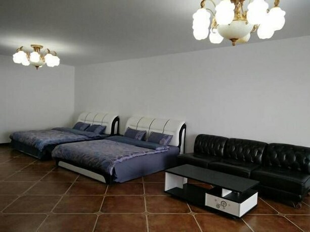 Imagen de la habitación del Hotel Weihai Haina Holiday Apartment. Foto 19