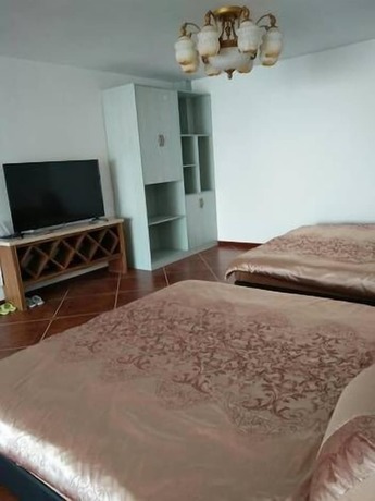 Imagen de la habitación del Hotel Weihai Haina Holiday Apartment. Foto 25