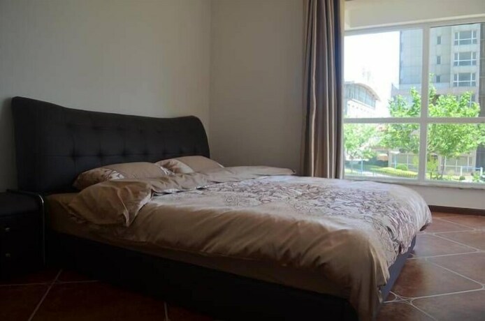 Imagen de la habitación del Hotel Weihai Haina Holiday Apartment. Foto 26