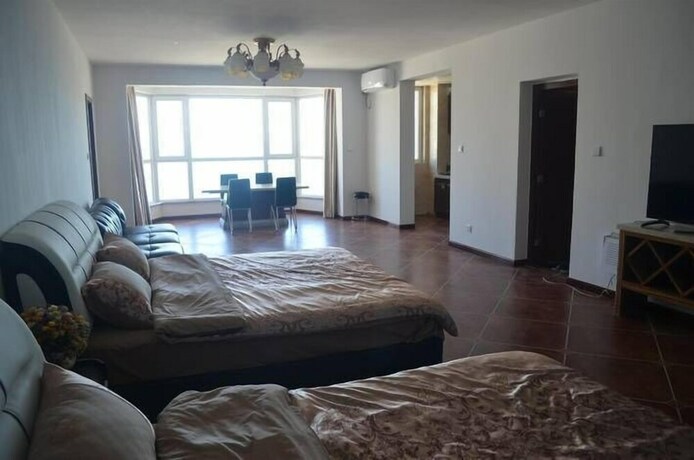Imagen de la habitación del Hotel Weihai Haina Holiday Apartment. Foto 29