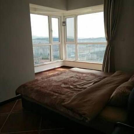 Imagen de la habitación del Hotel Weihai Haina Holiday Apartment. Foto 30