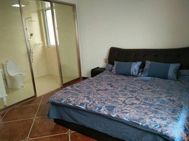 Imagen de la habitación del Hotel Weihai Haina Holiday Apartment. Foto 32