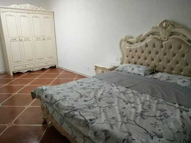 Imagen de la habitación del Hotel Weihai Haina Holiday Apartment. Foto 33