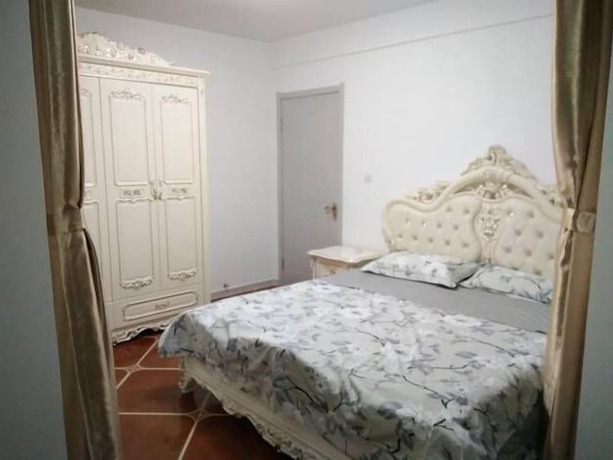 Imagen de la habitación del Hotel Weihai Haina Holiday Apartment. Foto 34