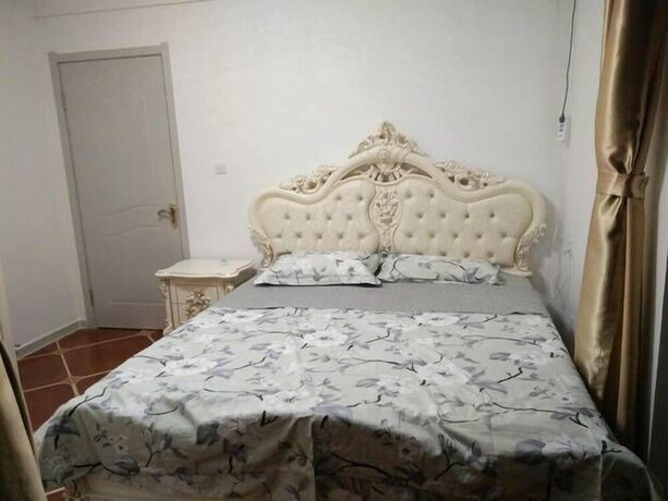 Imagen de la habitación del Hotel Weihai Haina Holiday Apartment. Foto 35