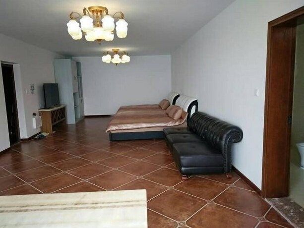 Imagen de la habitación del Hotel Weihai Haina Holiday Apartment. Foto 36