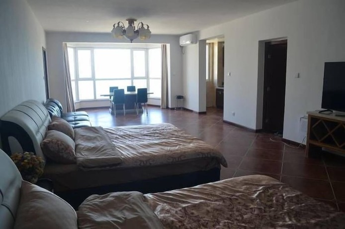 Imagen de la habitación del Hotel Weihai Haina Holiday Apartment. Foto 37