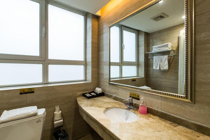 Imagen de la habitación del Hotel Weihai Huakun. Foto 6