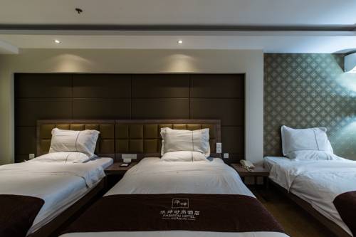 Imagen de la habitación del Hotel Weihai Huakun. Foto 12