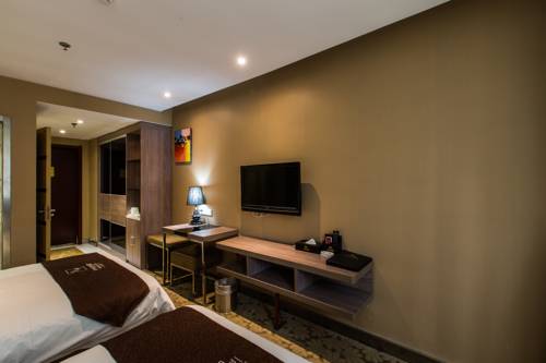 Imagen de la habitación del Hotel Weihai Huakun. Foto 13