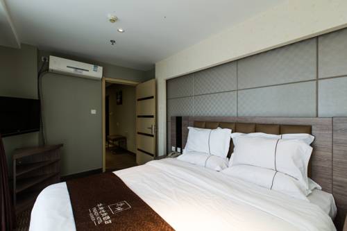 Imagen de la habitación del Hotel Weihai Huakun. Foto 14