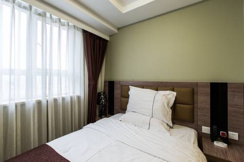 Imagen de la habitación del Hotel Weihai Huakun. Foto 15