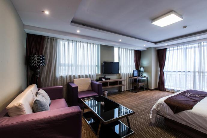 Imagen de la habitación del Hotel Weihai Huakun. Foto 16