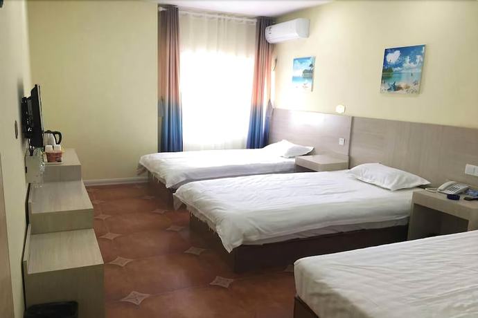 Imagen de la habitación del Hotel Weihai Mediterranean. Foto 10
