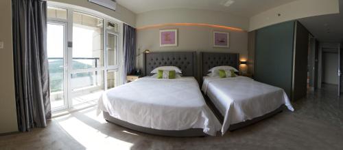 Imagen general del Hotel Weihai Qingtiwan Holiday. Foto 4