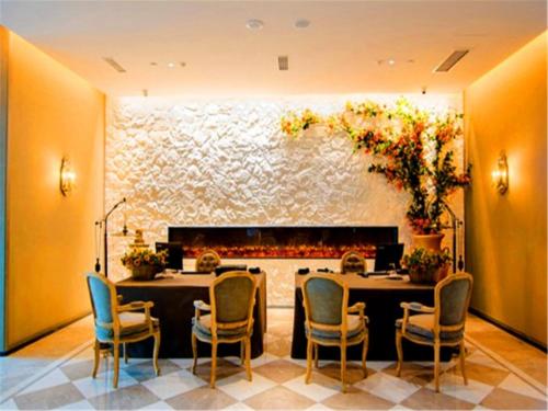 Imagen de la habitación del Hotel Weihai Qingtiwan Holiday. Foto 8