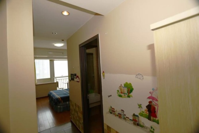 Imagen de la habitación del Hotel Weihai Suba Seaview Holiday Apartment. Foto 19
