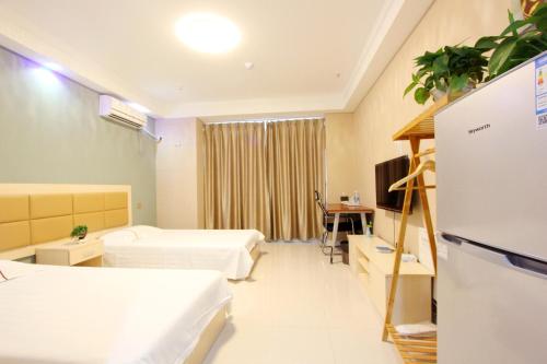 Imagen de la habitación del Hotel Weihai You Gang Vacation Aparthotel. Foto 8