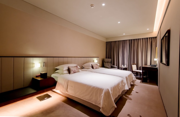 Imagen de la habitación del Hotel Weihaiwei Hotel. Foto 11