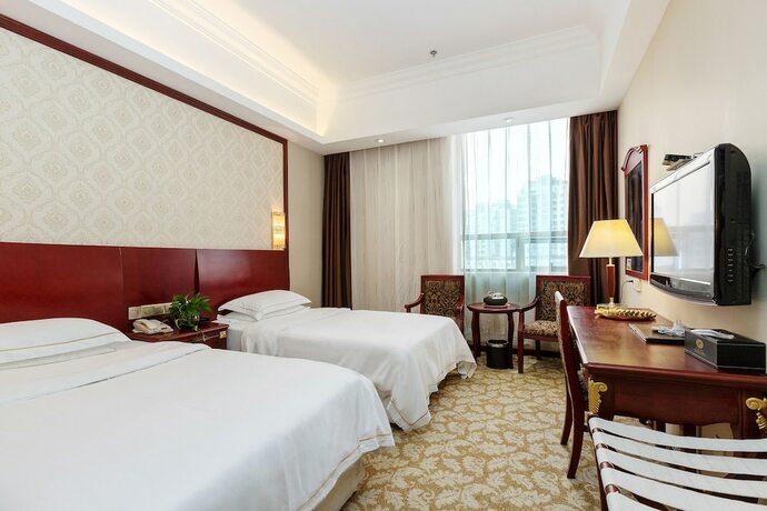 Imagen de la habitación del Hotel Weiluola Hotel Xiamen. Foto 13