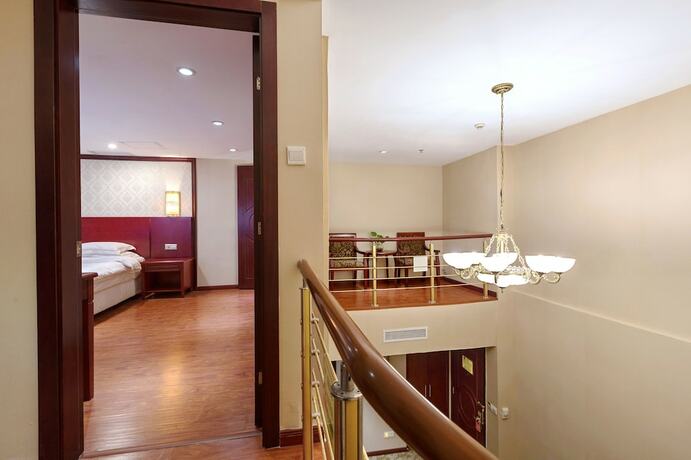 Imagen de la habitación del Hotel Weiluola Hotel Xiamen. Foto 18
