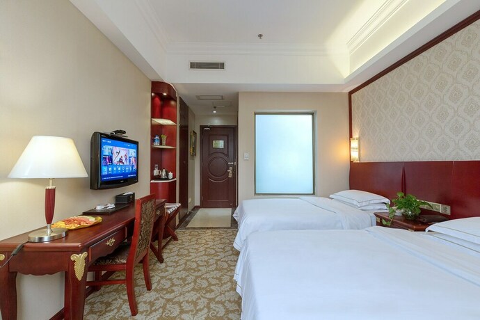 Imagen de la habitación del Hotel Weiluola Hotel Xiamen. Foto 19