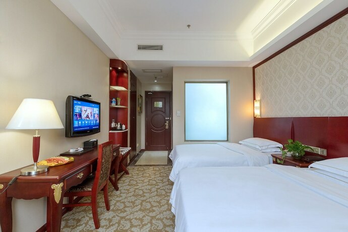 Imagen de la habitación del Hotel Weiluola Hotel Xiamen. Foto 22