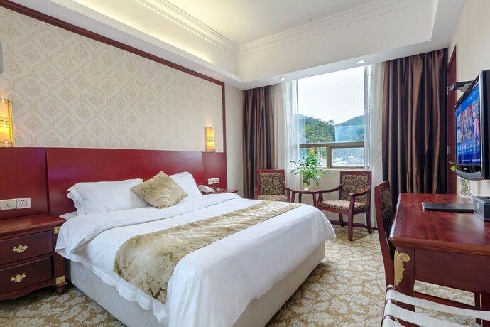 Imagen de la habitación del Hotel Weiluola Hotel Xiamen. Foto 23