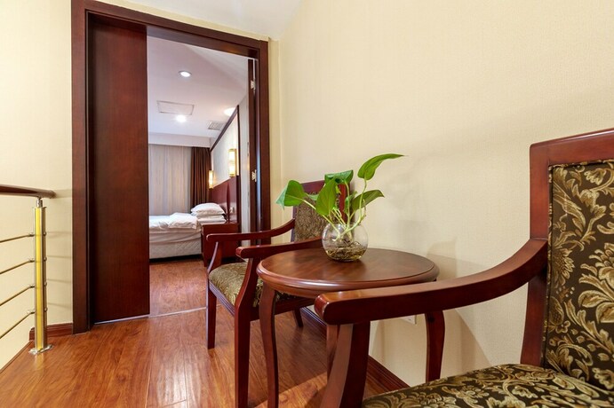 Imagen de la habitación del Hotel Weiluola Hotel Xiamen. Foto 25