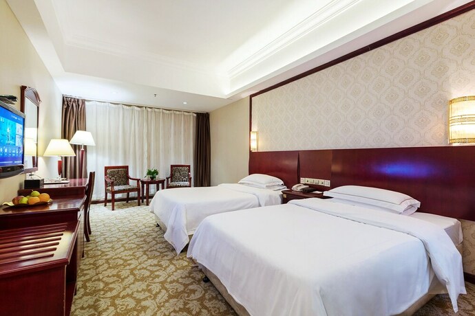 Imagen de la habitación del Hotel Weiluola Hotel Xiamen. Foto 27