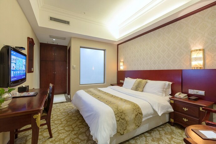 Imagen de la habitación del Hotel Weiluola Hotel Xiamen. Foto 32