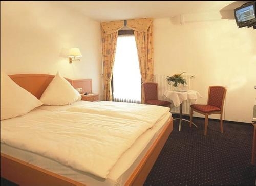 Imagen de la habitación del Hotel Weinberghotel Nalbach. Foto 10