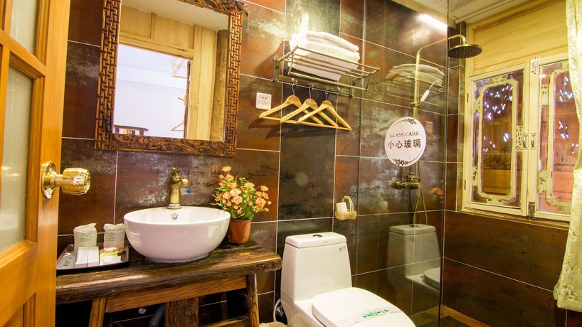 Imagen de la habitación del Hotel Weishan Ancient Town Boutique Inn. Foto 7