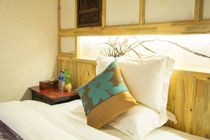 Imagen de la habitación del Hotel Weishan Ancient Town Boutique Inn. Foto 13