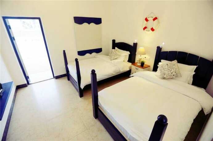 Imagen de la habitación del Hotel Weizhou Island Shengxiaguangnian Inn. Foto 11