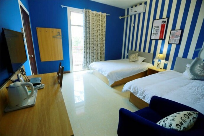 Imagen de la habitación del Hotel Weizhou Island Shengxiaguangnian Inn. Foto 19