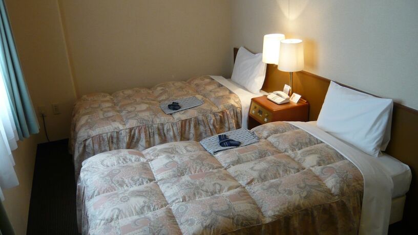 Imagen de la habitación del Hotel Welco Inn Yodoyabashi. Foto 8