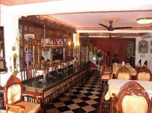 Imagen del bar/restaurante del Hotel WelcomHeritage Grace. Foto 3