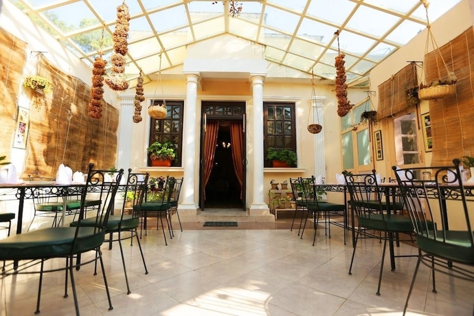 Imagen del bar/restaurante del Hotel WelcomHeritage Windsor Lodge. Foto 5