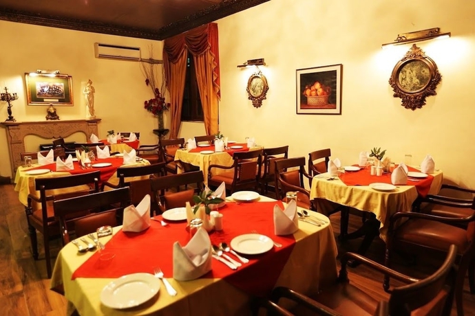 Imagen del bar/restaurante del Hotel WelcomHeritage Windsor Lodge. Foto 7