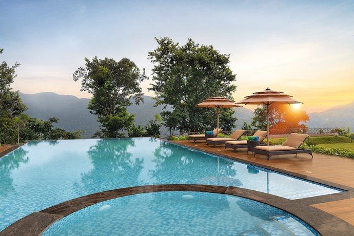 Imagen de la piscina del Hotel Welcomhotel By ITC Hotels Jim Corbett. Foto 15