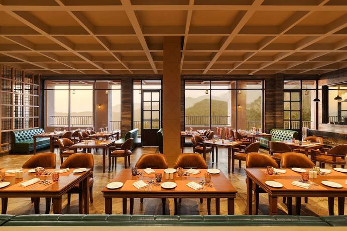 Imagen del bar/restaurante del Hotel Welcomhotel By ITC Hotels Jim Corbett. Foto 3