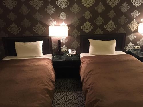 Imagen de la habitación del Hotel Well Garden. Foto 7