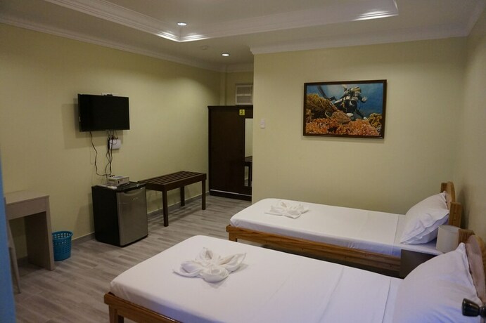 Imagen de la habitación del Hotel Wellbeach Dive Resort. Foto 32