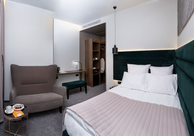 Imagen de la habitación del Hotel Wellion Suharevskiy. Foto 2