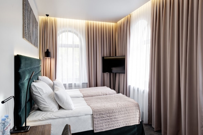 Imagen de la habitación del Hotel Wellion Suharevskiy. Foto 12