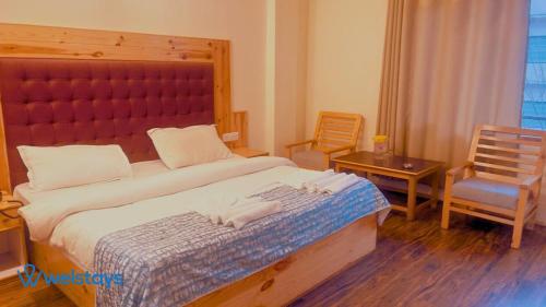 Imagen de la habitación del Hotel Welstays Hadimba Temple. Foto 15