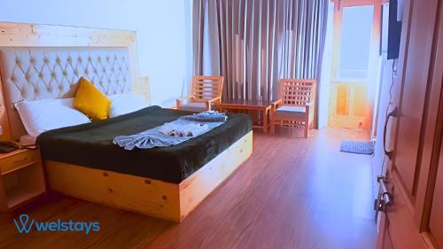 Imagen de la habitación del Hotel Welstays Hadimba Temple. Foto 17