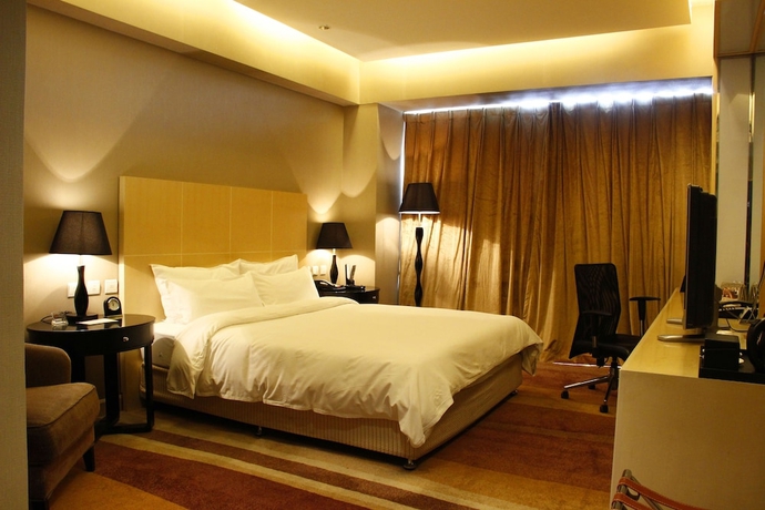 Imagen de la habitación del Hotel Wenjin. Foto 14